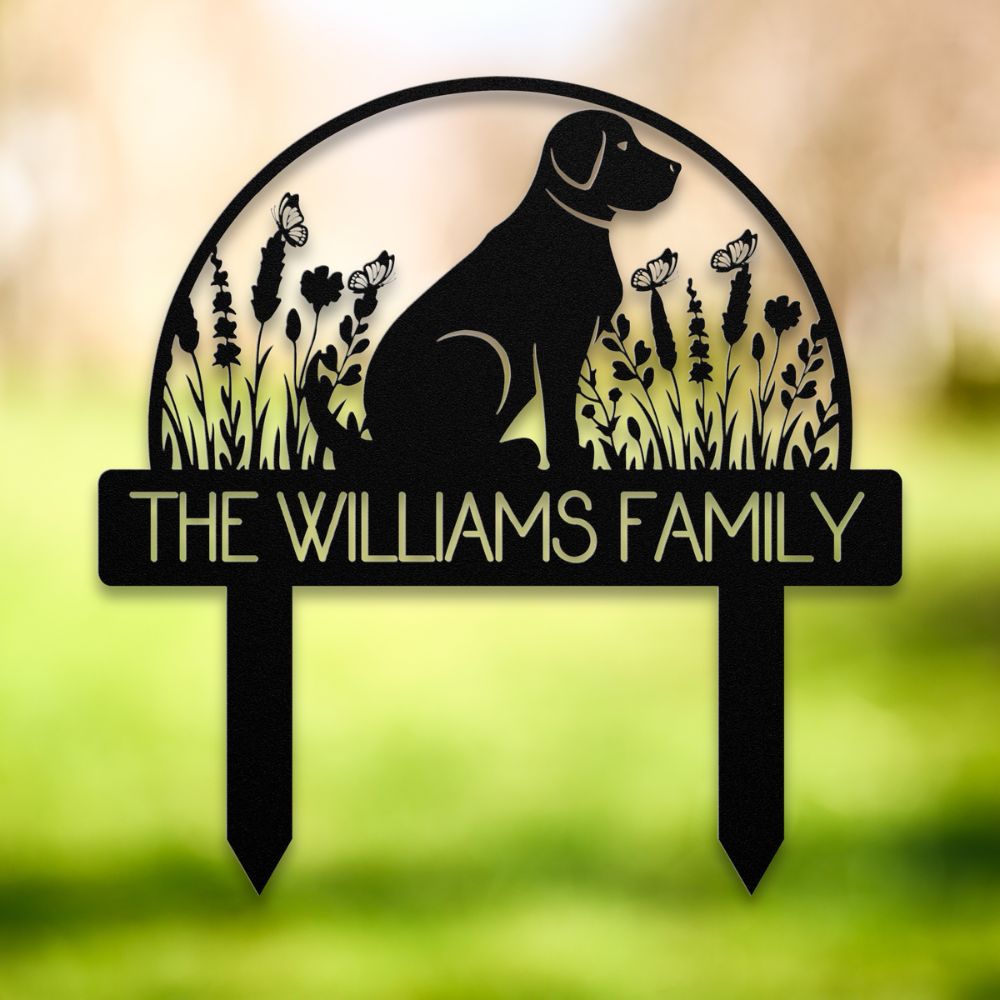 Personalized black metal yard stake featuring a sitting dog silhouette, wildflowers, butterflies, and custom family name 'The Williams Family' – decorative garden sign for dog lovers.