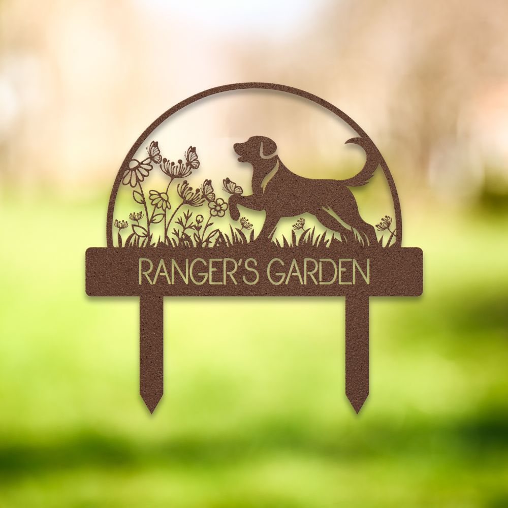 Custom metal dog garden stake featuring a playful Labrador-style silhouette surrounded by wildflowers and butterflies. Personalized outdoor yard sign with “RANGER'S GARDEN” cutout text – perfect pet memorial or dog lover gift for garden decor.